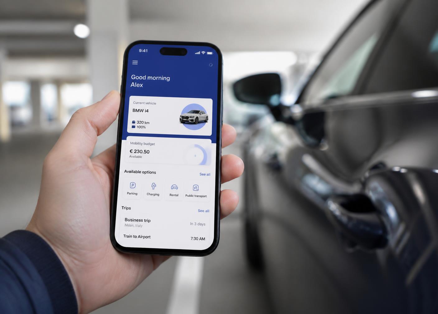 Driver using a mobility app on a smartphone next to a car